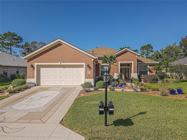 ranch-style home featuring a garage, a front yard, and french doors