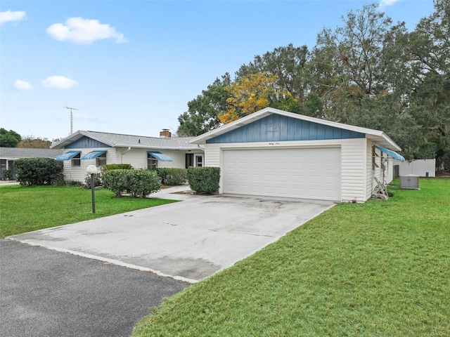 ranch-style house with a front yard and a garage