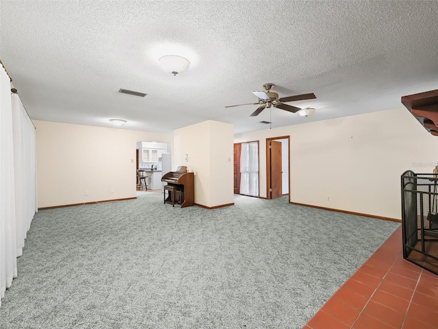 living room with ceiling fan, carpet floors, and a textured ceiling