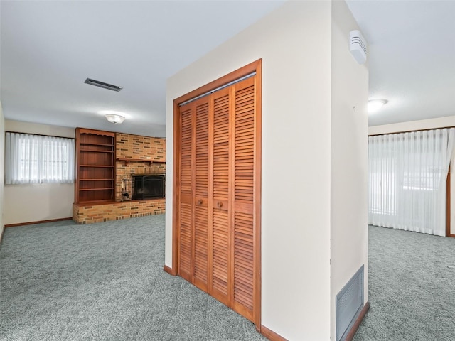 hallway with carpet floors