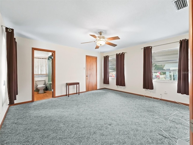 spare room featuring carpet flooring and ceiling fan