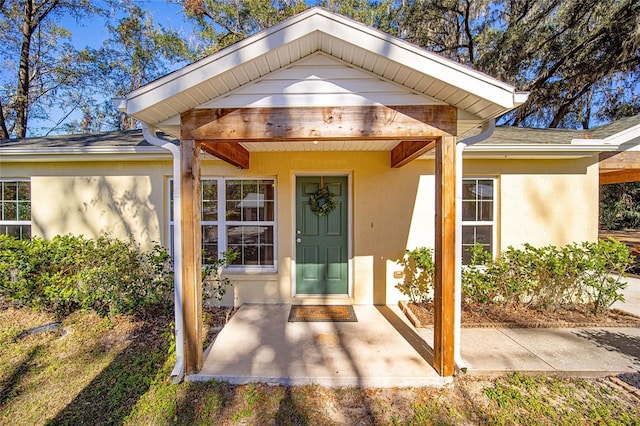 entrance to property with a patio area