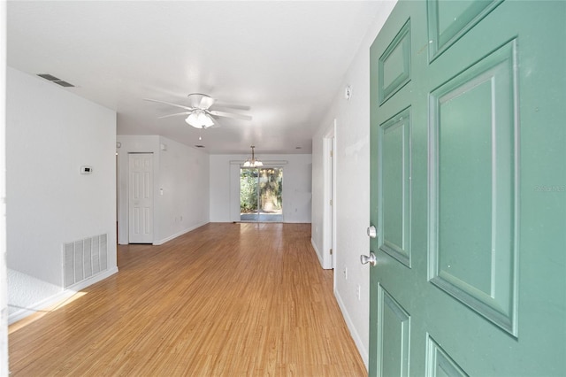 interior space with ceiling fan and light hardwood / wood-style flooring