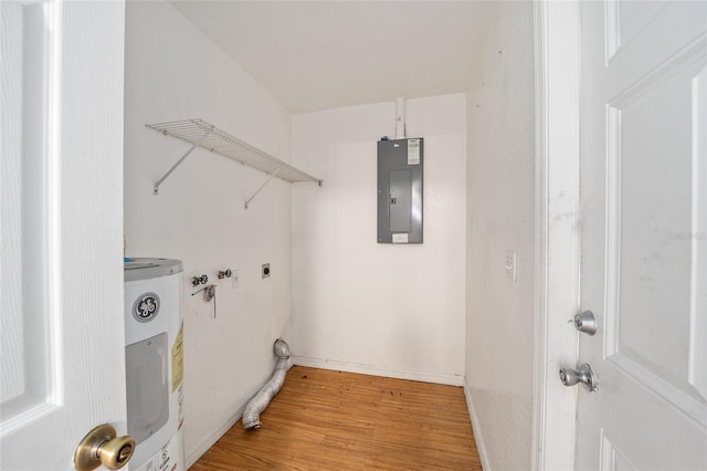 washroom with electric panel, water heater, hookup for a washing machine, and light wood-type flooring