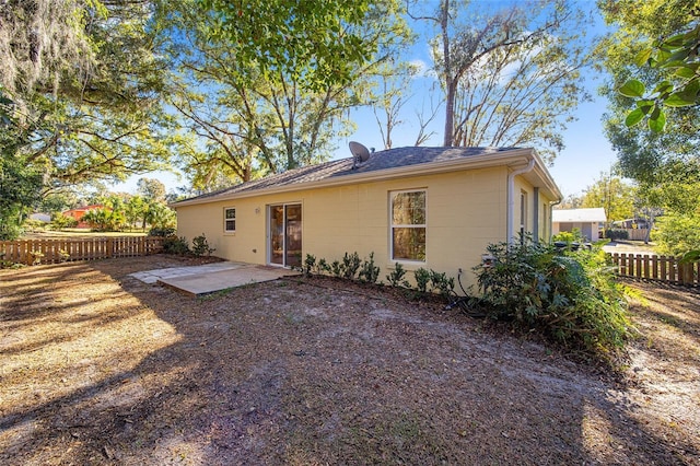 back of property with a patio area