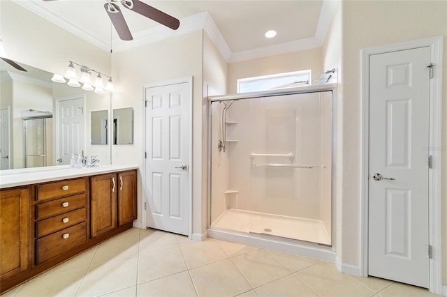 bathroom with tile patterned flooring, vanity, an enclosed shower, and ornamental molding