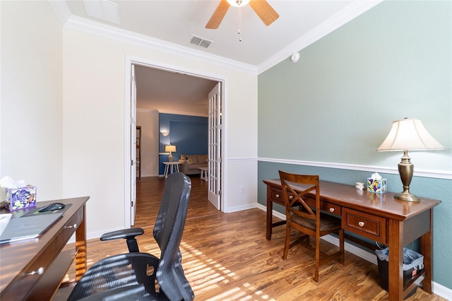 office space featuring ceiling fan, wood-type flooring, and ornamental molding