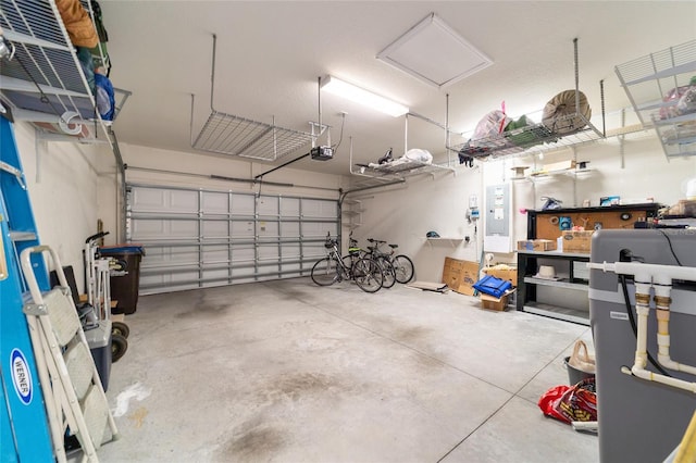 garage with electric panel and a garage door opener