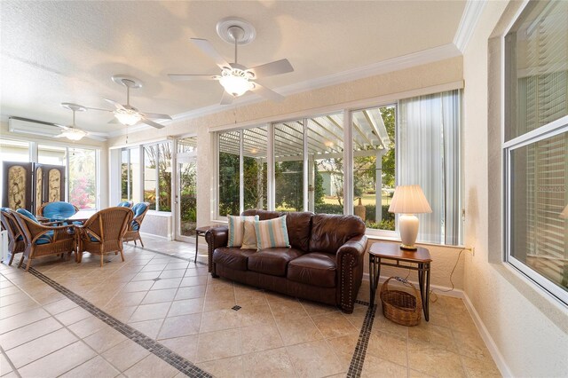 sunroom featuring ceiling fan