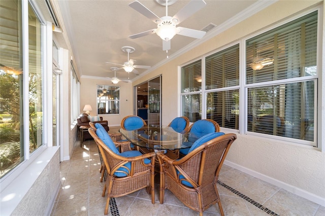 sunroom / solarium with ceiling fan