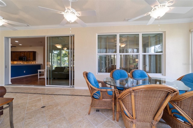 view of patio featuring ceiling fan