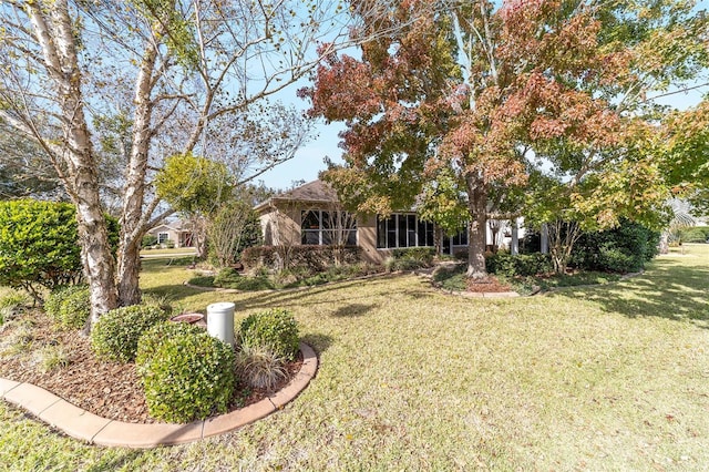 view of front of home with a front yard