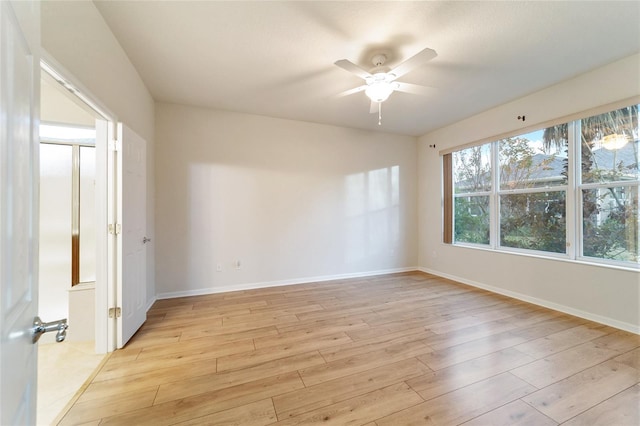 unfurnished room with ceiling fan and light hardwood / wood-style flooring