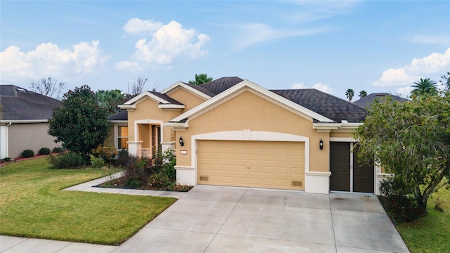 view of front facade with a garage and a front lawn