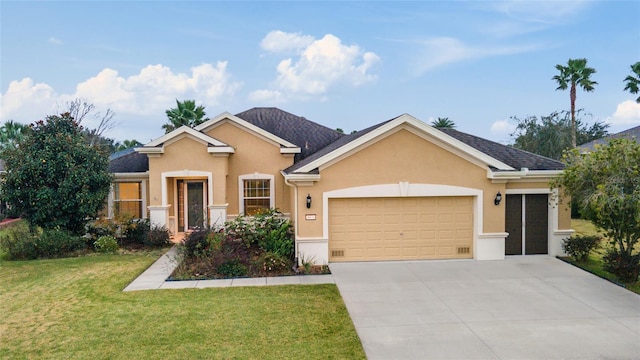 view of front of house with a front yard and a garage