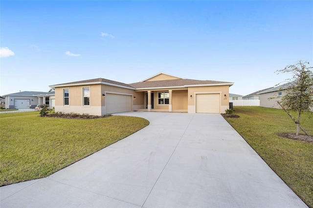 view of front of property with a garage and a front lawn