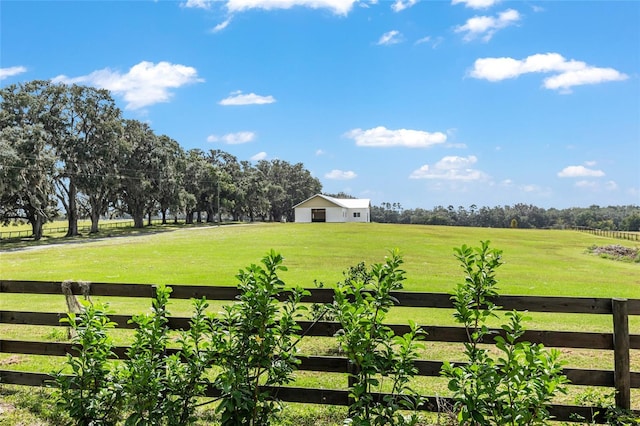 view of yard with a rural view