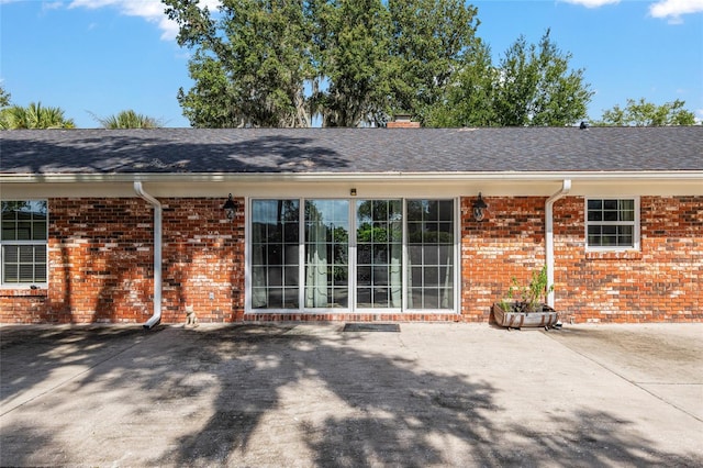 back of house with a patio