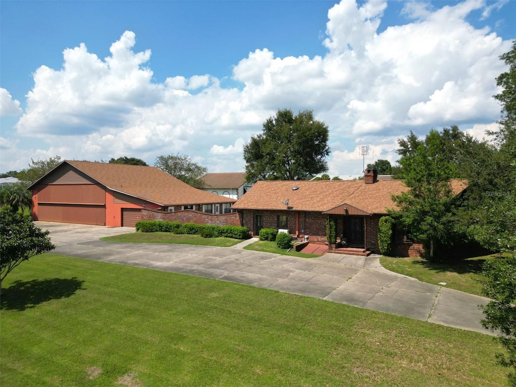 ranch-style house with a front lawn