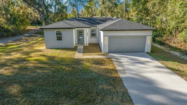 single story home with a garage and a front lawn