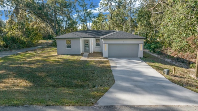 view of front facade featuring a garage and a front lawn