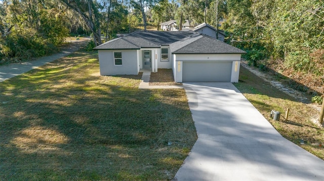 single story home featuring a front yard and a garage