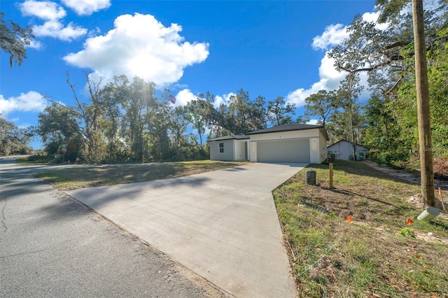 ranch-style home featuring a garage