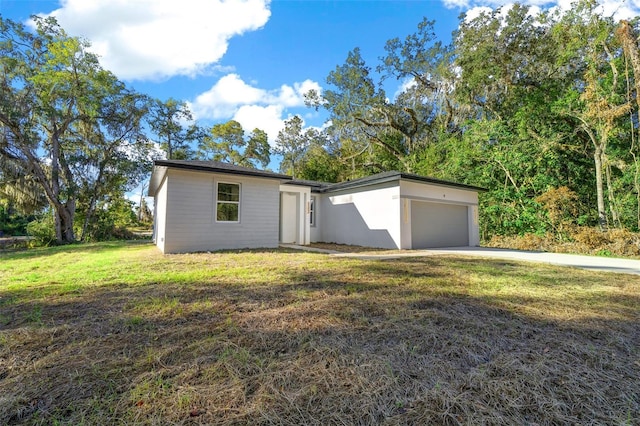 ranch-style house with a front lawn and a garage