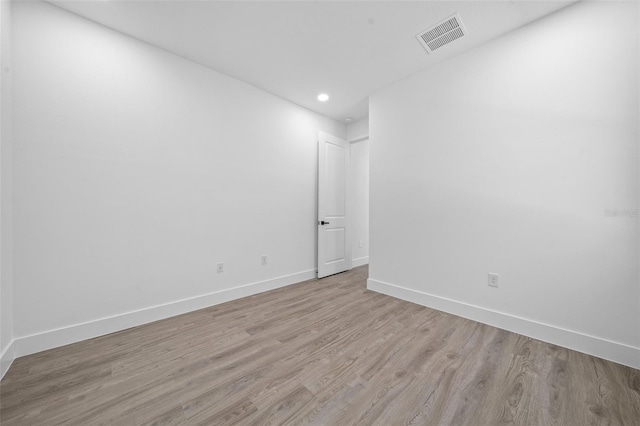 spare room with light hardwood / wood-style floors