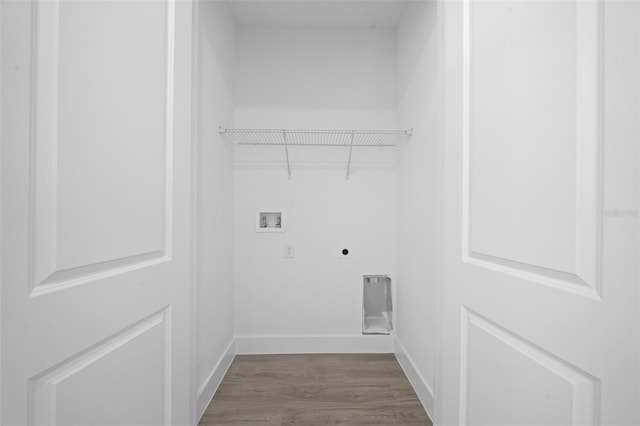 washroom with electric dryer hookup, washer hookup, and hardwood / wood-style flooring