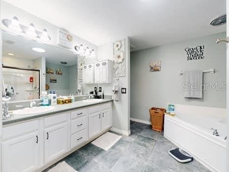 bathroom featuring vanity and a bathing tub