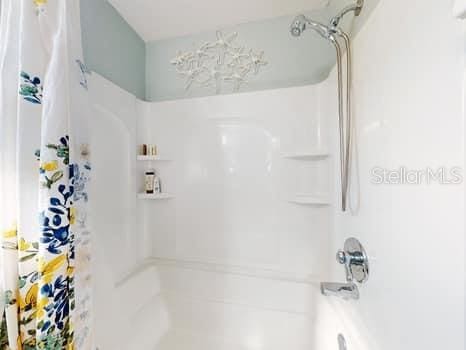 bathroom with shower / bath combination