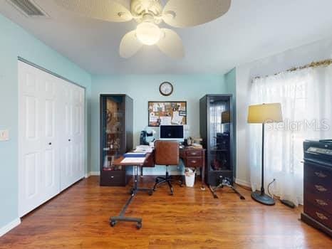 office space featuring hardwood / wood-style flooring and ceiling fan