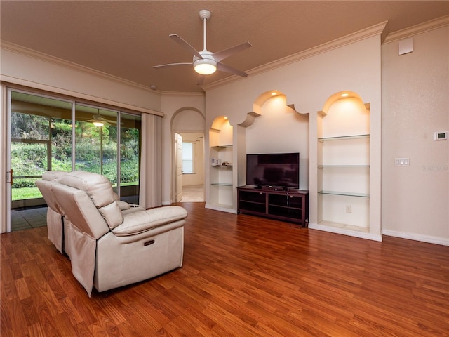 living room featuring wood-type flooring and built in features