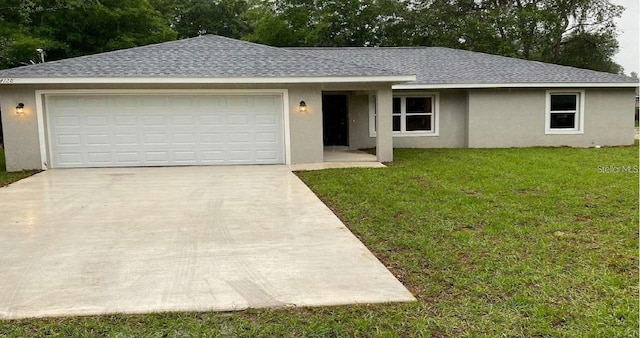 ranch-style house with a front yard and a garage