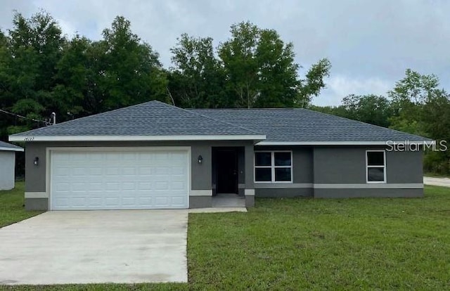 ranch-style home with a front yard and a garage