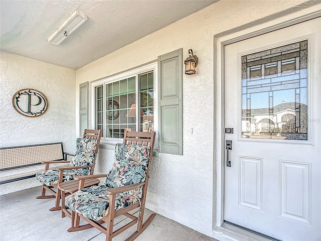 doorway to property with covered porch