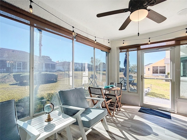 sunroom / solarium with ceiling fan