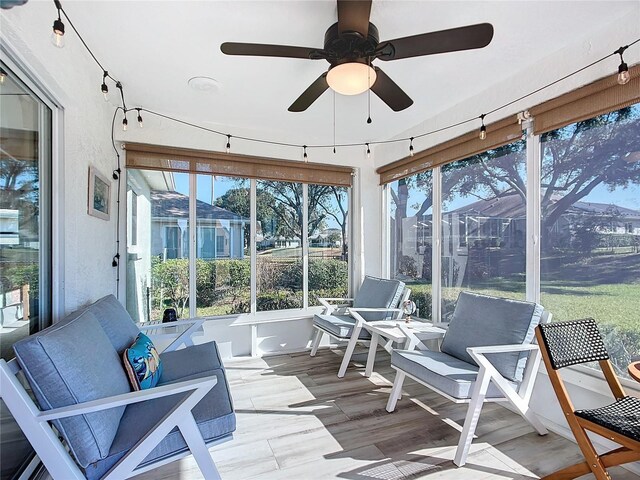 sunroom / solarium with ceiling fan