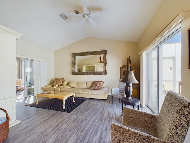 living room featuring ceiling fan, wood-type flooring, and lofted ceiling