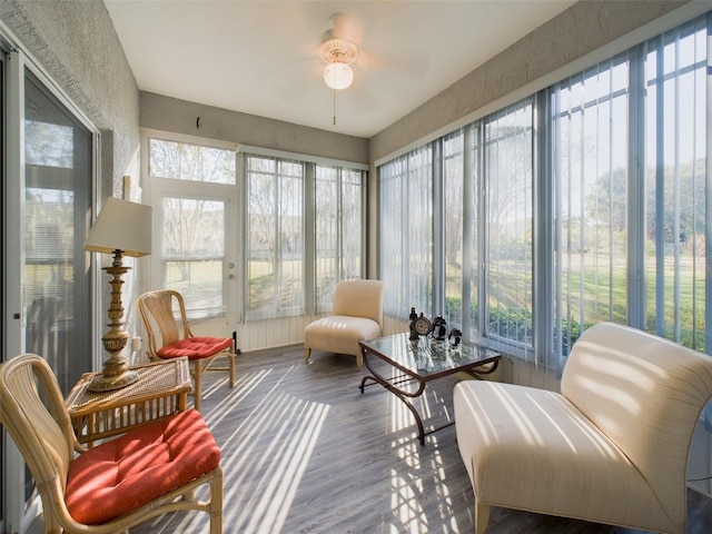 sunroom with plenty of natural light and ceiling fan