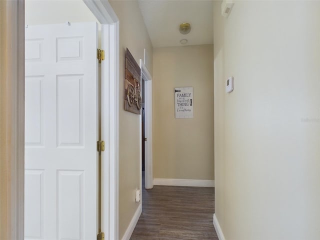 hall featuring dark wood-type flooring