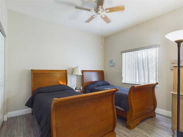 bedroom with hardwood / wood-style flooring and ceiling fan