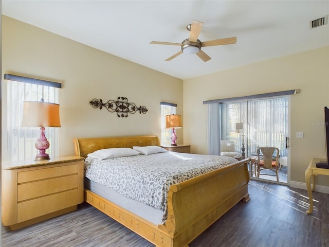 bedroom with ceiling fan and dark wood-type flooring