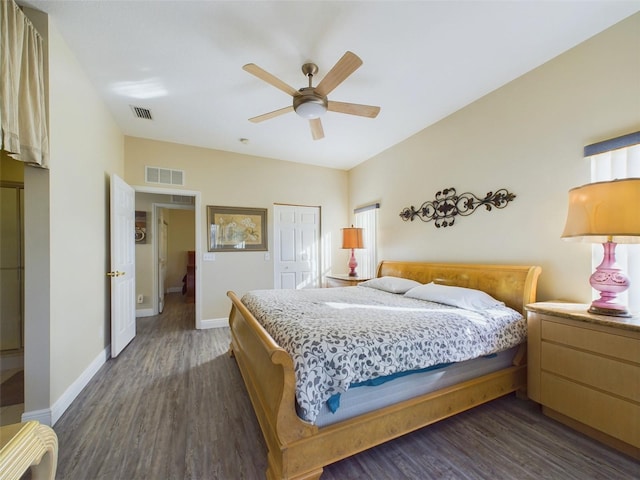 bedroom with ceiling fan, a closet, and dark wood-type flooring