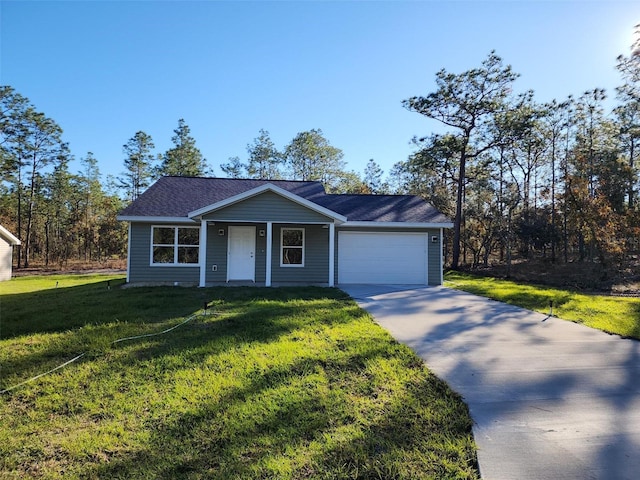 single story home featuring a garage and a front lawn