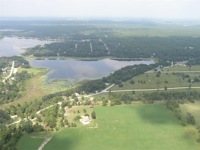 birds eye view of property with a rural view and a water view