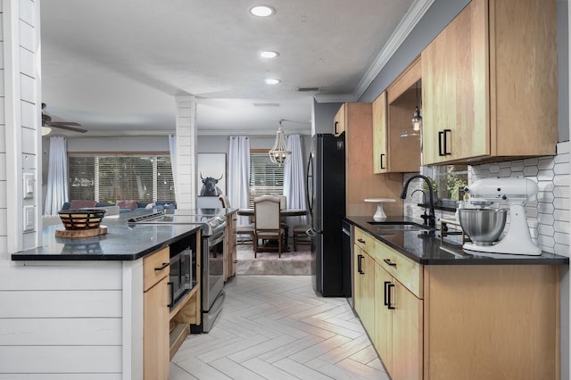 kitchen featuring sink, ornamental molding, appliances with stainless steel finishes, plenty of natural light, and light parquet floors