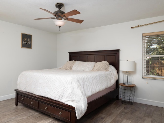 bedroom featuring hardwood / wood-style flooring and ceiling fan