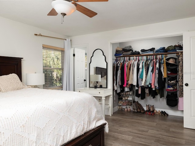 bedroom featuring ceiling fan, dark hardwood / wood-style flooring, and a closet